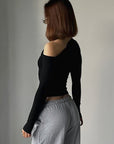 Chic Black Long Sleeve T-Shirt with Asymmetrical Design